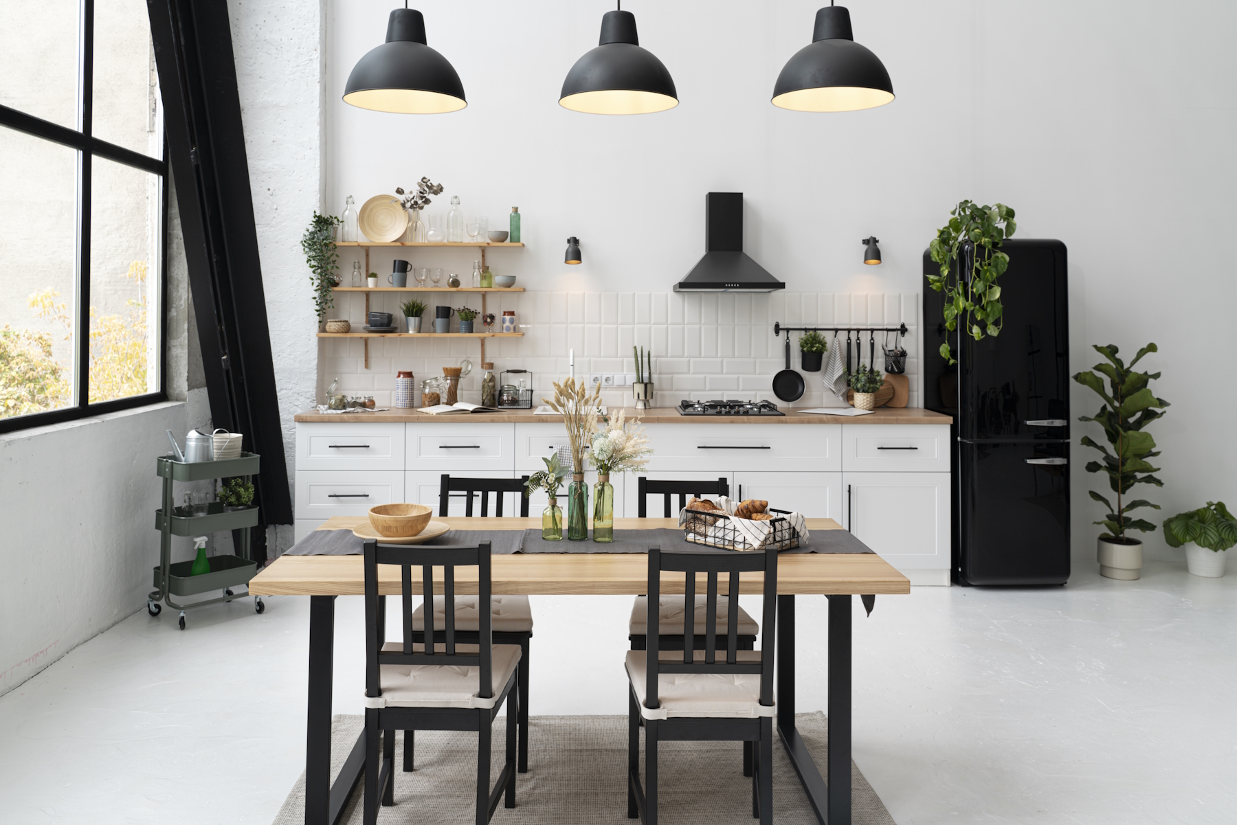 A kitchen finished with a farmhouse look to it with wooden cabinets, white countertops, and rustic light fixtures.