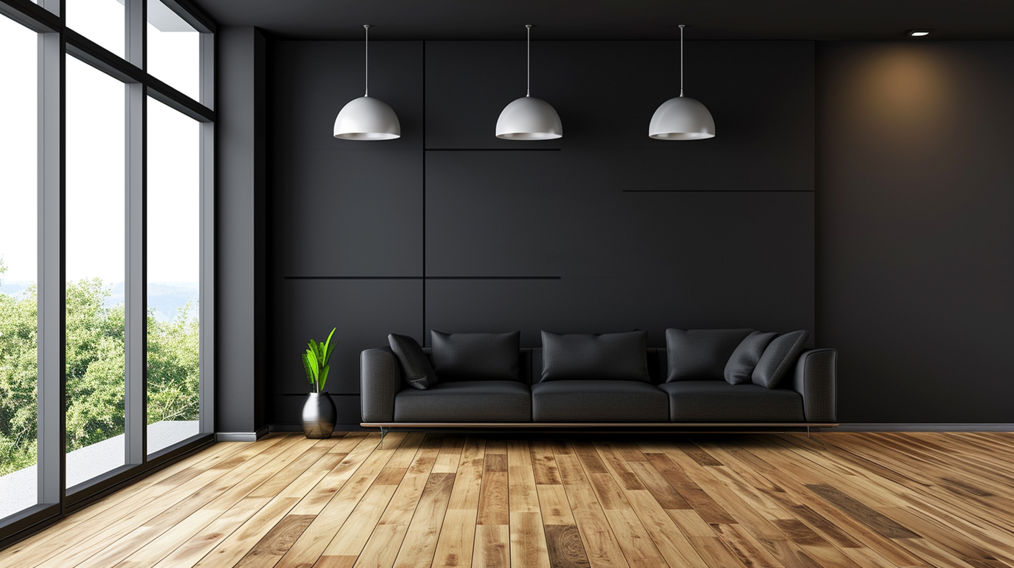 A living room with black walls, wood floors, and a black couch with lights hanging from the ceiling.