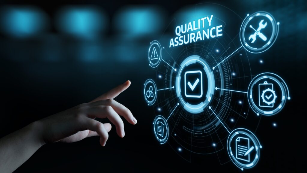 Close view of a hand reaching out toward a radial graphic hovering in mid-air. The top of the graphic reads “Quality Assurance,” and there’s a white checkmark in the middle. Emblems signifying quality surround the checkmark and have lines that link to it.
