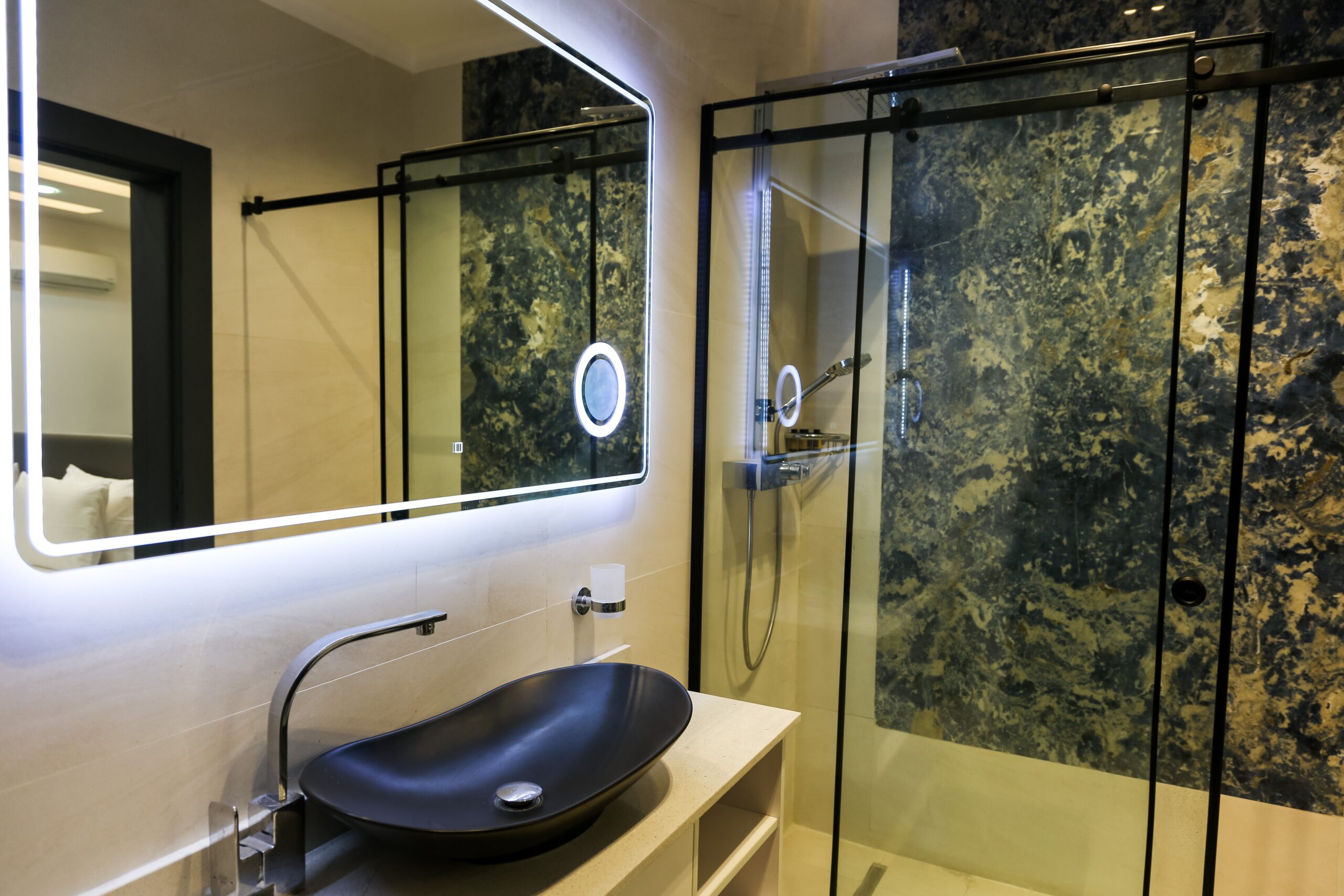 Reliable Acrylic Showers In Huntington Beach, CA | EGM Construction A beautiful shower with a white shower base and a shower bench sitting inside it.